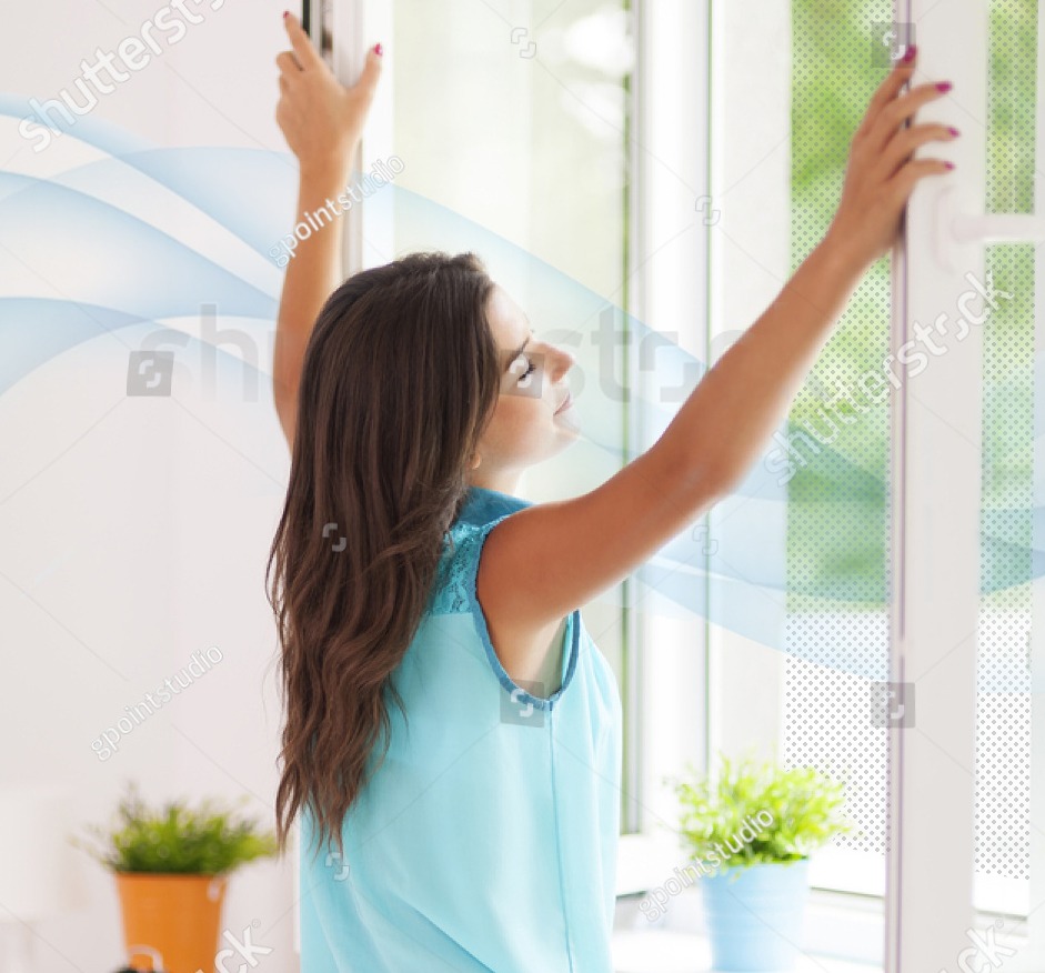 women by window breathing clear air