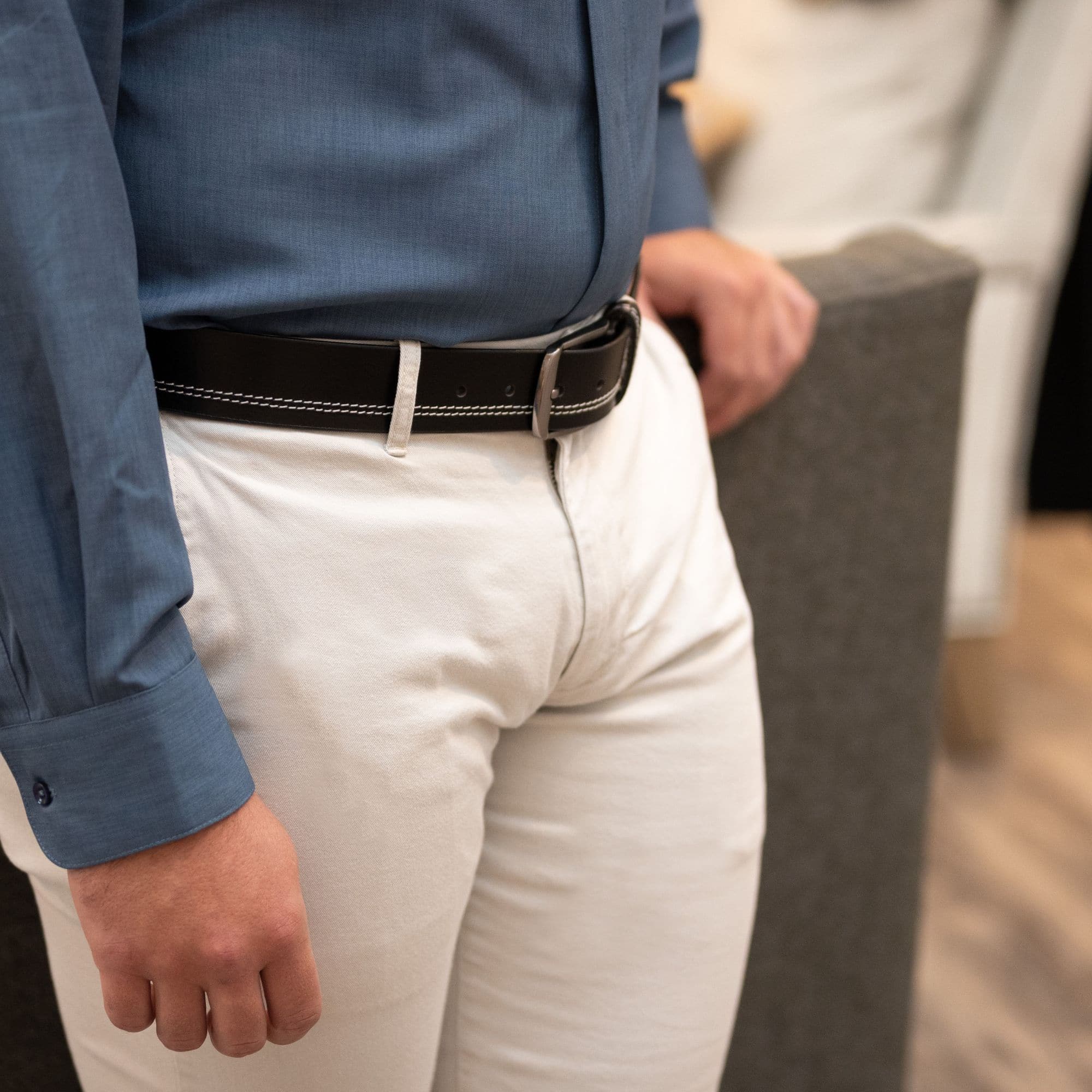Millennial Black Leather Stitched Belt on a model in khakis