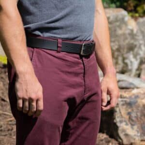 Slick City Black Leather Belt on a model in red slacks