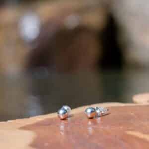 Sterling silver balls on wooden surface